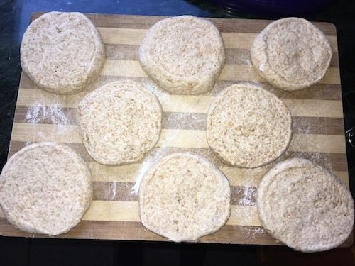 Pita dough rounds cut and flattened, waiting to be pressed